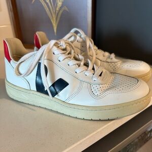 VEJA sneakers with blue and red.